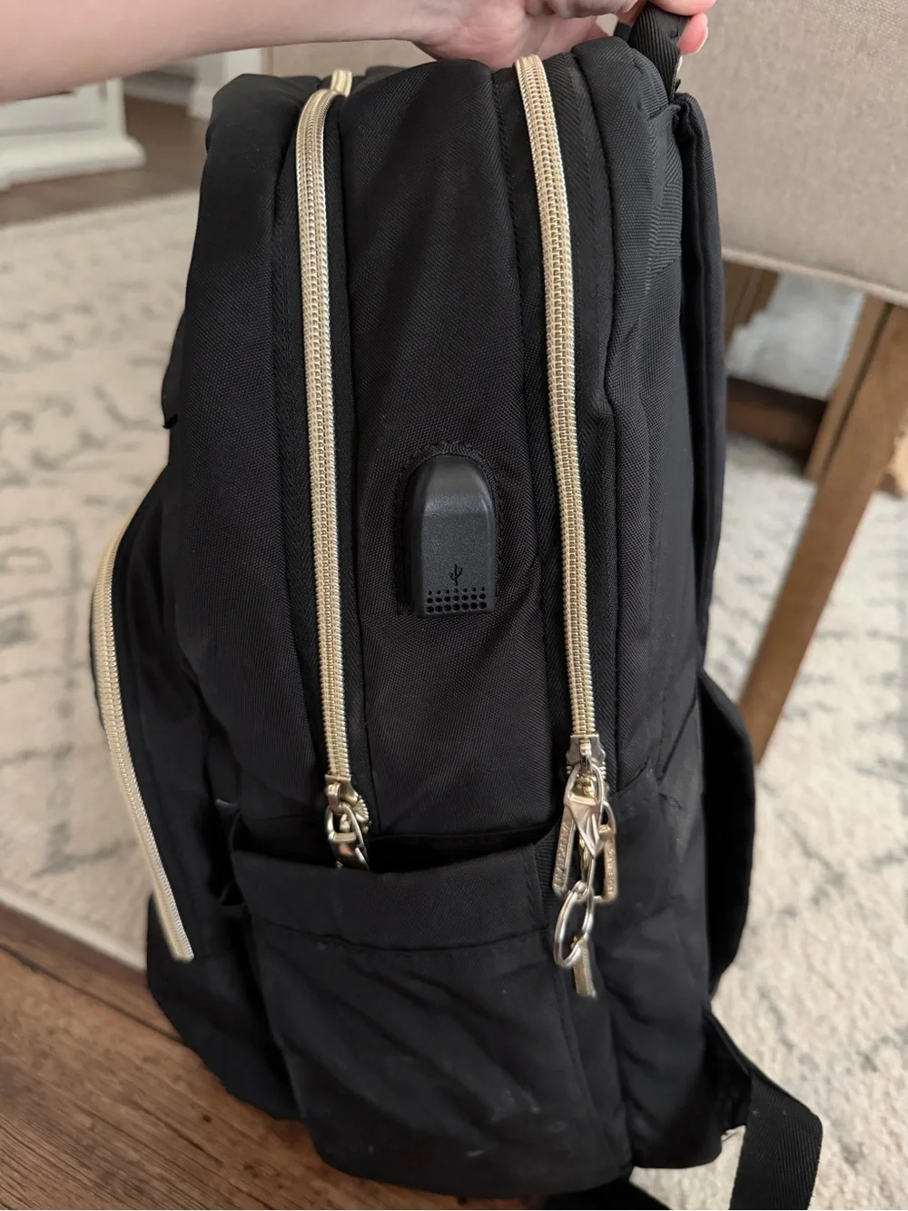 Amazon Black Quilted Backpack with Gold Accents